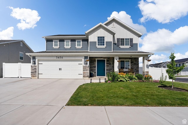 3456 S Linden Way, Syracuse, UT 84075 - view of front facade featuring board and batten siding, concrete driveway, a garage, a porch, and stone siding