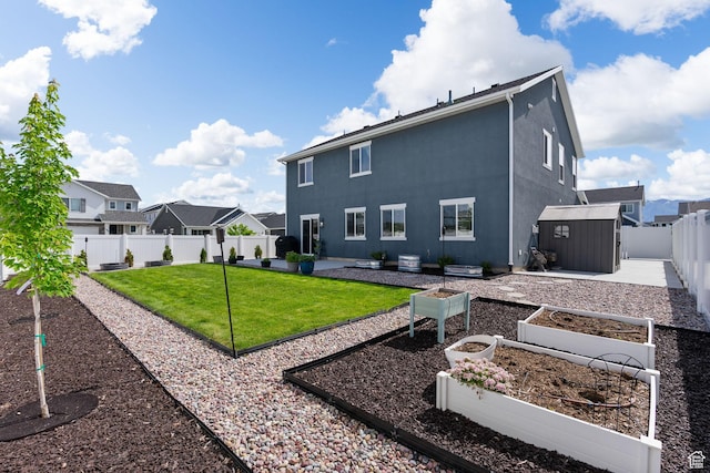 3456 S Linden Way, Syracuse, UT 84075 - rear view of house with a vegetable garden, a residential view, and stucco siding