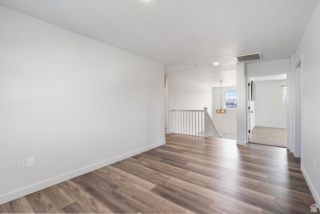 3456 S Linden Way, Syracuse, UT 84075 - unfurnished room with wood finished floors, baseboards, and recessed lighting
