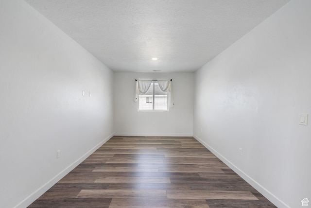3456 S Linden Way, Syracuse, UT 84075 - unfurnished room with baseboards, wood finished floors, and a textured ceiling