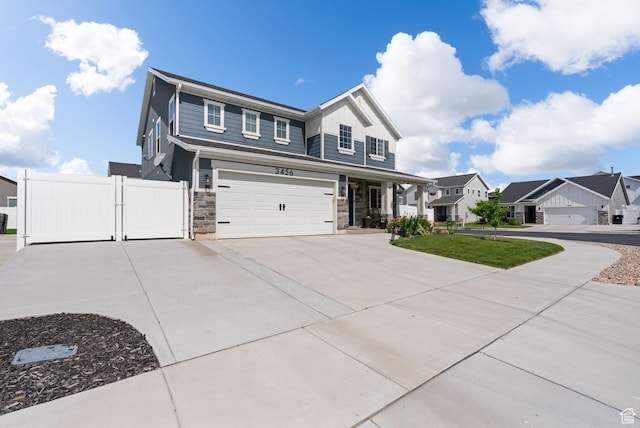 3456 S Linden Way, Syracuse, UT 84075 - view of front of home with stone siding, a garage, a gate, driveway, and a residential view