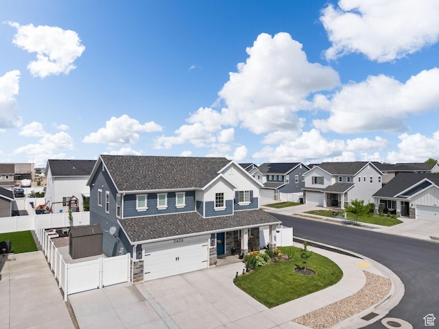 3456 S Linden Way, Syracuse, UT 84075 - view of front of home with a residential view, a garage, a gate, concrete driveway, and stone siding