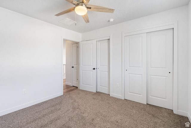 3456 S Linden Way, Syracuse, UT 84075 - unfurnished bedroom with two closets, carpet, baseboards, and a ceiling fan
