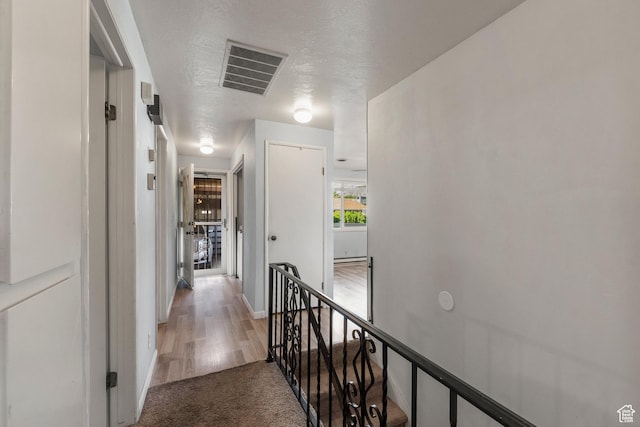 871 E 5575 S, South Ogden, UT 84405 - hall with an upstairs landing, light carpet, baseboards, and light wood-style flooring