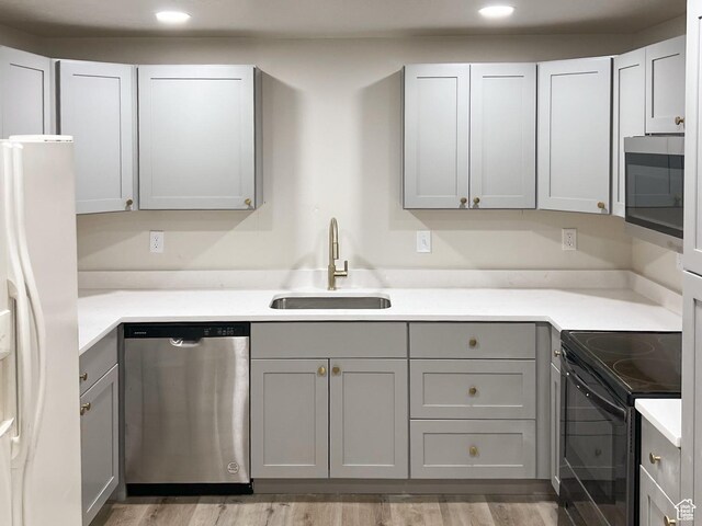 10861 N Panorama Dr, Highland, UT 84003 - kitchen featuring appliances with stainless steel finishes, a sink, gray cabinetry, recessed lighting, and light countertops