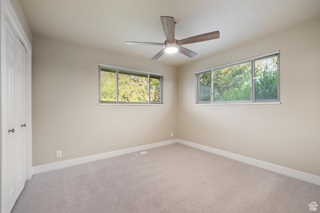 10861 N Panorama Dr, Highland, UT 84003 - unfurnished bedroom featuring light carpet, a closet, baseboards, and a ceiling fan