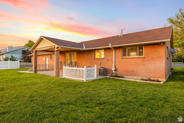 10861 N Panorama Dr, Highland, UT 84003 - rear view of house with a patio, brick siding, a shingled roof, and central AC unit