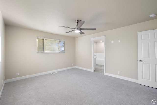 10861 N Panorama Dr, Highland, UT 84003 - unfurnished bedroom with carpet flooring, baseboards, ensuite bathroom, and ceiling fan