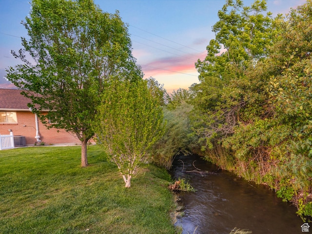 10861 N Panorama Dr, Highland, UT 84003 - view of grassy yard featuring central AC unit