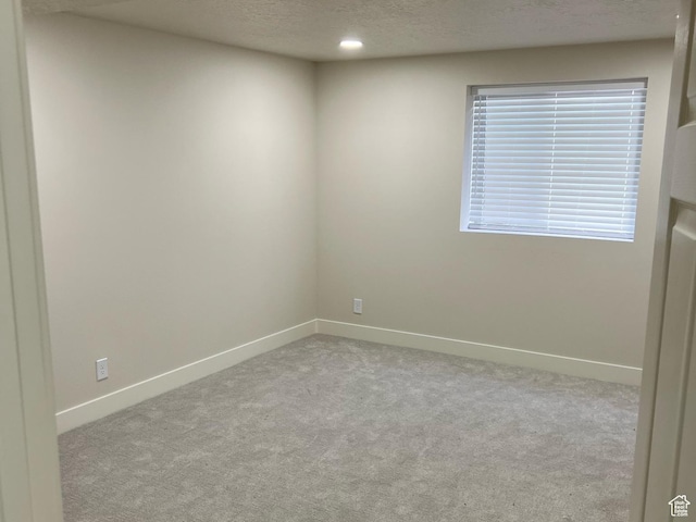 10861 N Panorama Dr, Highland, UT 84003 - empty room featuring carpet floors, baseboards, a textured ceiling, and recessed lighting