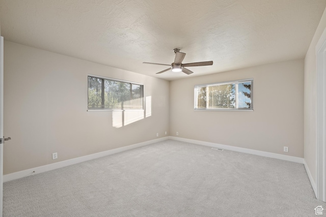 10861 N Panorama Dr, Highland, UT 84003 - unfurnished room featuring ceiling fan, light carpet, and healthy amount of natural light