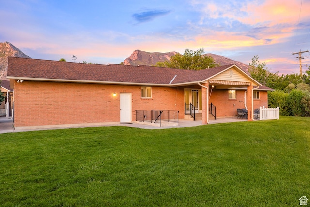 10861 N Panorama Dr, Highland, UT 84003 - back of property with a patio, brick siding, entry steps, and a mountain view