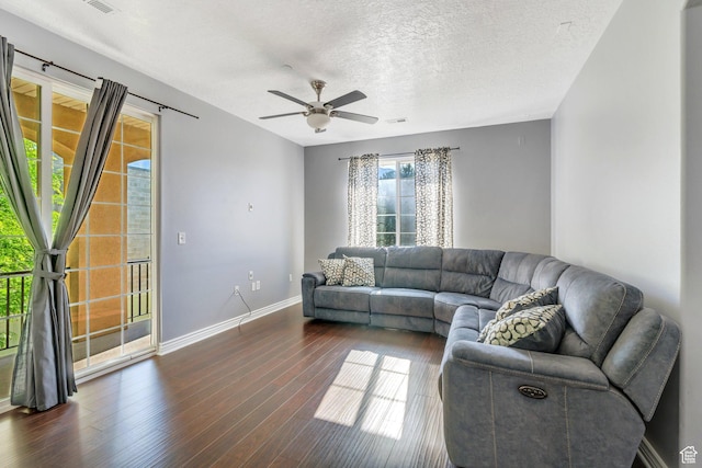 1292 W Dallin Dr N, Pleasant Grove, UT 84062 - living room featuring a ceiling fan, dark wood-style flooring, baseboards, and a textured ceiling