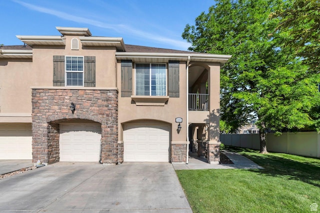 1292 W Dallin Dr N, Pleasant Grove, UT 84062 - view of front facade featuring stone siding, stucco siding, driveway, an attached garage, and a balcony