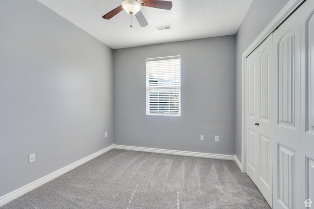 1292 W Dallin Dr N, Pleasant Grove, UT 84062 - unfurnished bedroom featuring a closet, carpet flooring, a textured ceiling, baseboards, and ceiling fan