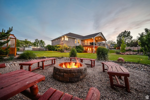 4234 W Swensen Farm Dr S, Riverton, UT 84096 - patio terrace at dusk featuring an outdoor fire pit