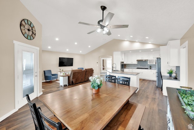 4234 W Swensen Farm Dr S, Riverton, UT 84096 - dining space with a ceiling fan, arched walkways, recessed lighting, dark wood-style flooring, and high vaulted ceiling