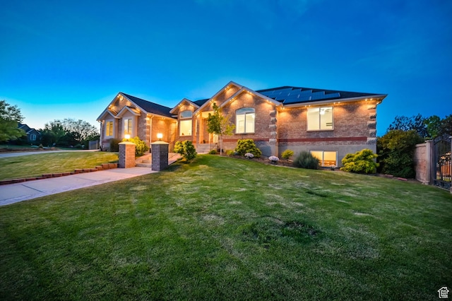 4234 W Swensen Farm Dr S, Riverton, UT 84096 - view of front of house featuring roof mounted solar panels and brick siding