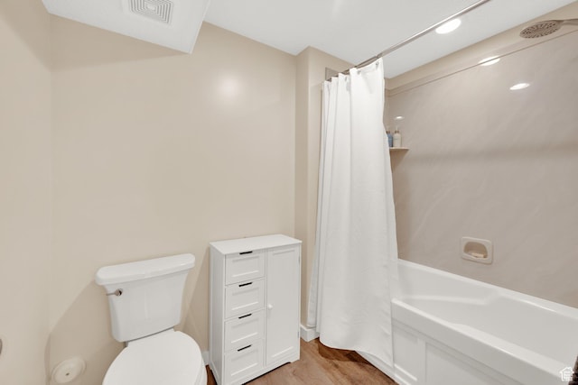 4234 W Swensen Farm Dr S, Riverton, UT 84096 - full bathroom with wood finished floors, toilet, and shower / bathtub combination with curtain