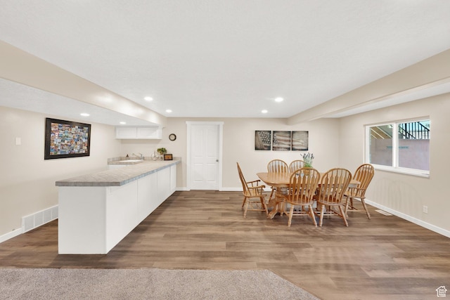 4234 W Swensen Farm Dr S, Riverton, UT 84096 - dining room with baseboards, recessed lighting, wood finished floors, and wet bar