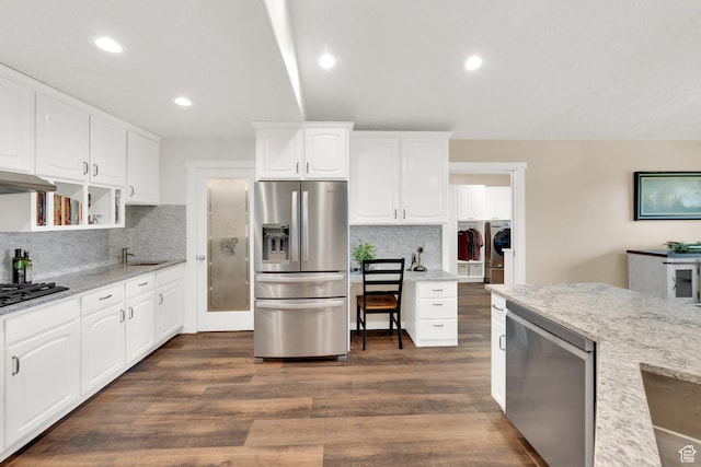 4234 W Swensen Farm Dr S, Riverton, UT 84096 - kitchen featuring stainless steel refrigerator with ice dispenser, washing machine and dryer, a sink, tasteful backsplash, and white cabinets