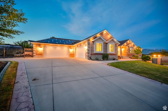 4234 W Swensen Farm Dr S, Riverton, UT 84096 - ranch-style house featuring an attached garage, driveway, solar panels, and brick siding