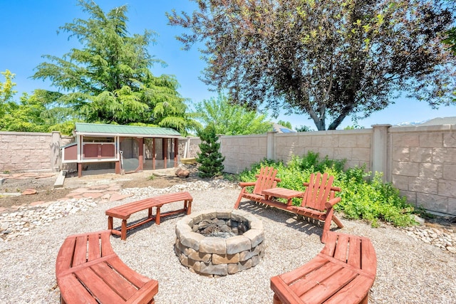 4234 W Swensen Farm Dr S, Riverton, UT 84096 - fenced backyard featuring a fire pit and exterior structure