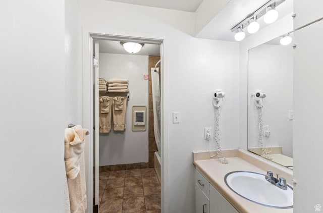 2176 S Bear Blvd Unit 404, Garden City, UT 84028 - full bathroom with vanity and baseboards