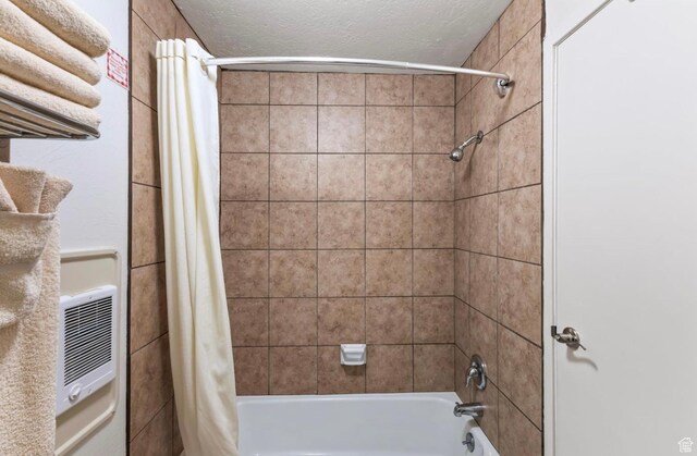 2176 S Bear Blvd Unit 404, Garden City, UT 84028 - full bath featuring shower / tub combo with curtain and a textured ceiling