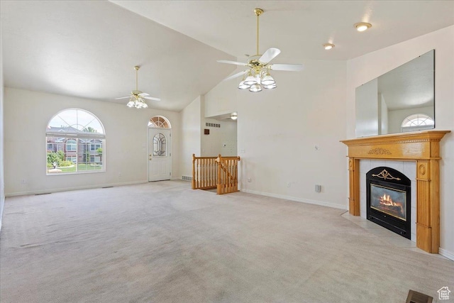 5645 S 3600 W, Roy, UT 84067 - unfurnished living room featuring a ceiling fan, light carpet, a fireplace, high vaulted ceiling, and baseboards