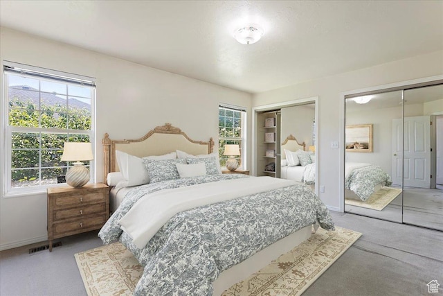 5645 S 3600 W, Roy, UT 84067 - carpeted bedroom featuring two closets and baseboards