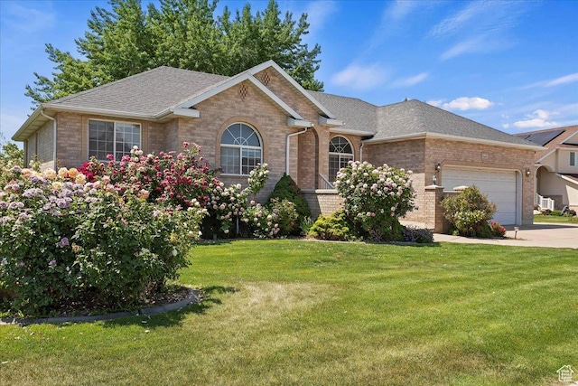 5645 S 3600 W, Roy, UT 84067 - ranch-style home featuring brick siding, an attached garage, a front lawn, and a shingled roof