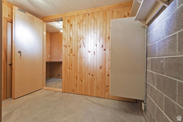 1358 E Tomahawk Dr N, Salt Lake City, UT 84103 - unfurnished bedroom with unfinished concrete flooring and wooden walls