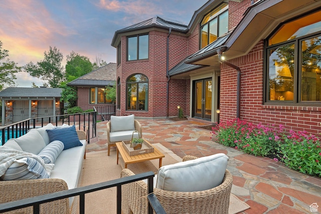 1358 E Tomahawk Dr N, Salt Lake City, UT 84103 - patio terrace at dusk featuring an outdoor hangout area, a patio area, and french doors