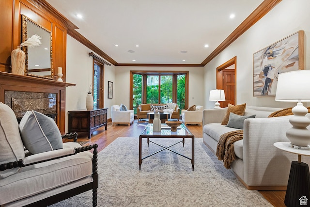 1358 E Tomahawk Dr N, Salt Lake City, UT 84103 - living room featuring light wood-style flooring, ornamental molding, a premium fireplace, and recessed lighting