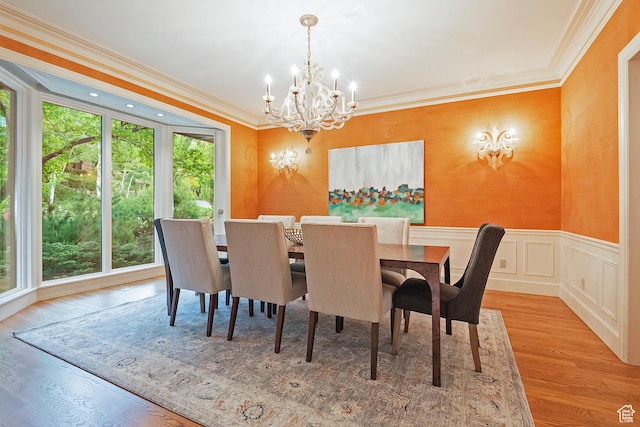 1358 E Tomahawk Dr N, Salt Lake City, UT 84103 - dining room with a chandelier, crown molding, wood finished floors, and a wainscoted wall