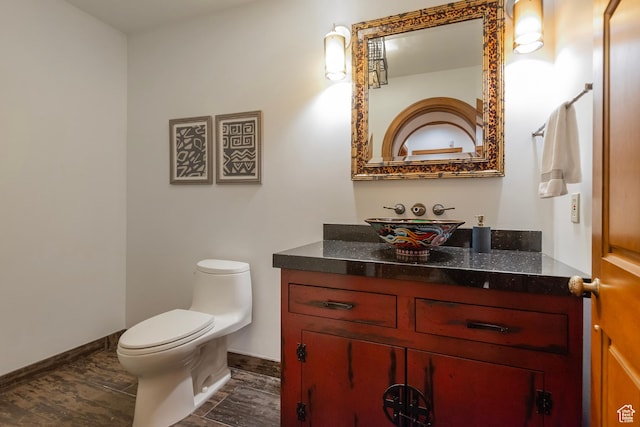1358 E Tomahawk Dr N, Salt Lake City, UT 84103 - half bath featuring vanity, toilet, and baseboards