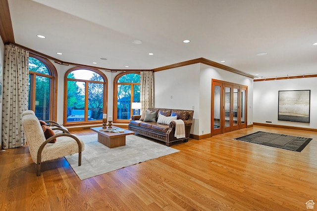 1358 E Tomahawk Dr N, Salt Lake City, UT 84103 - living area with ornamental molding, light wood finished floors, baseboards, recessed lighting, and french doors