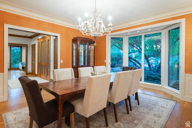 1358 E Tomahawk Dr N, Salt Lake City, UT 84103 - dining area featuring a chandelier, crown molding, and light wood-type flooring