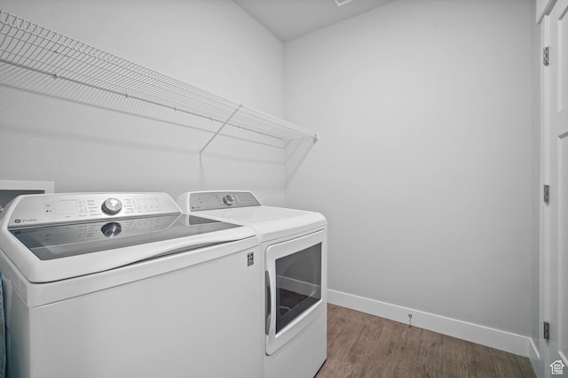 3665 W 1380 N Unit T201, Lehi, UT 84043 - laundry room with washer and dryer, baseboards, and wood finished floors