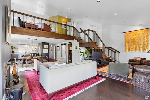939 S Donner Way Unit 308, Salt Lake City, UT 84108 - living area featuring stairs, wood finished floors, a high ceiling, and recessed lighting