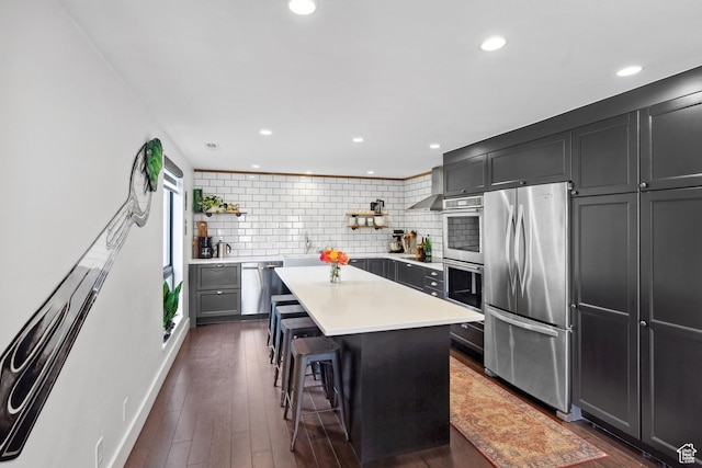 939 S Donner Way Unit 308, Salt Lake City, UT 84108 - kitchen with stainless steel appliances, open shelves, backsplash, light countertops, and recessed lighting