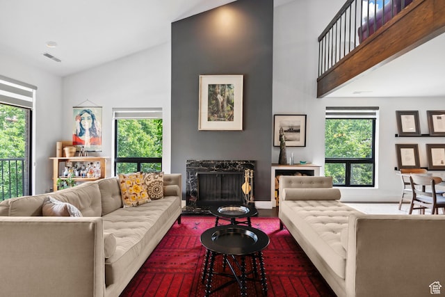 939 S Donner Way Unit 308, Salt Lake City, UT 84108 - living area featuring a fireplace, plenty of natural light, and high vaulted ceiling