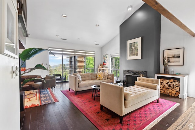 939 S Donner Way Unit 308, Salt Lake City, UT 84108 - living room with lofted ceiling, hardwood / wood-style flooring, a fireplace, and recessed lighting