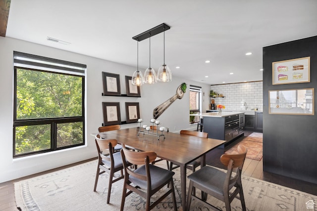 939 S Donner Way Unit 308, Salt Lake City, UT 84108 - dining space featuring plenty of natural light, recessed lighting, a chandelier, and light wood finished floors