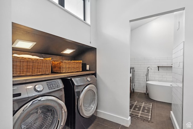 939 S Donner Way Unit 308, Salt Lake City, UT 84108 - laundry room with washing machine and clothes dryer, tile patterned floors, tile walls, and a wainscoted wall