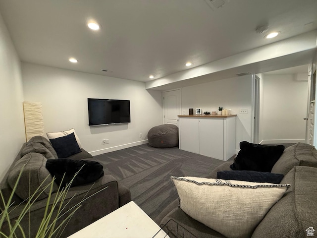4323 W Burwell Ln, Herriman, UT 84096 - living area with dark colored carpet, recessed lighting, and baseboards