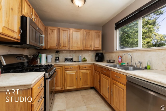 1132 E 360 S, Provo, UT 84606 - kitchen featuring stainless steel appliances, a sink, light countertops, and decorative backsplash