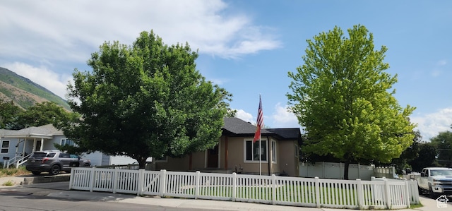 1132 E 360 S, Provo, UT 84606 - view of property hidden behind natural elements featuring a fenced front yard, stucco siding, and a mountain view
