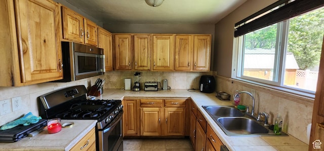 1132 E 360 S, Provo, UT 84606 - kitchen featuring stainless steel microwave, range with gas cooktop, tile counters, and a sink
